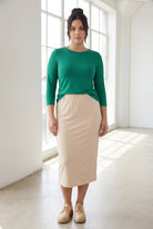 Model wearing Nuggles® 3/4 Essential Tee in Kelly Green