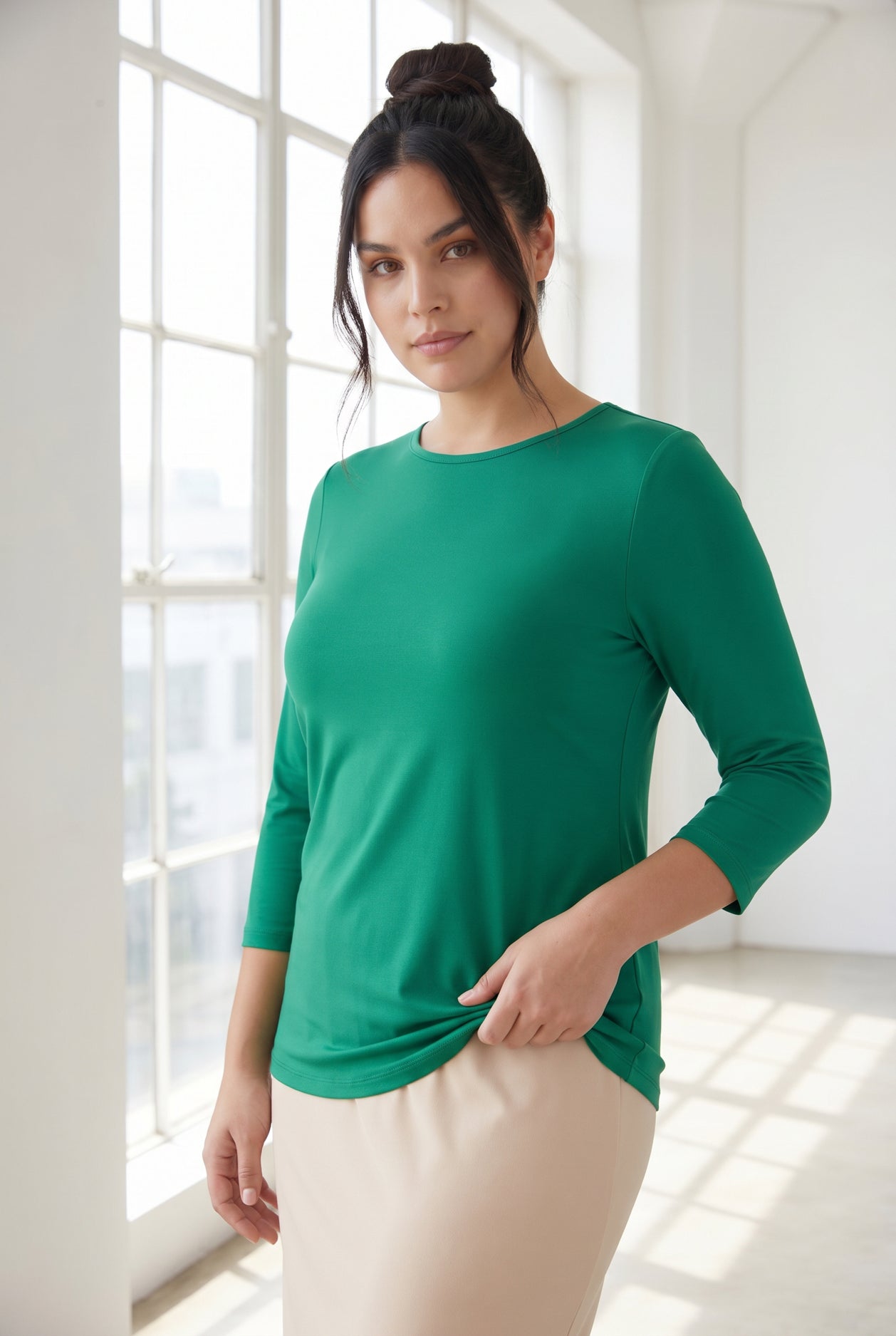Model wearing Nuggles® 3/4 Essential Tee in Kelly Green