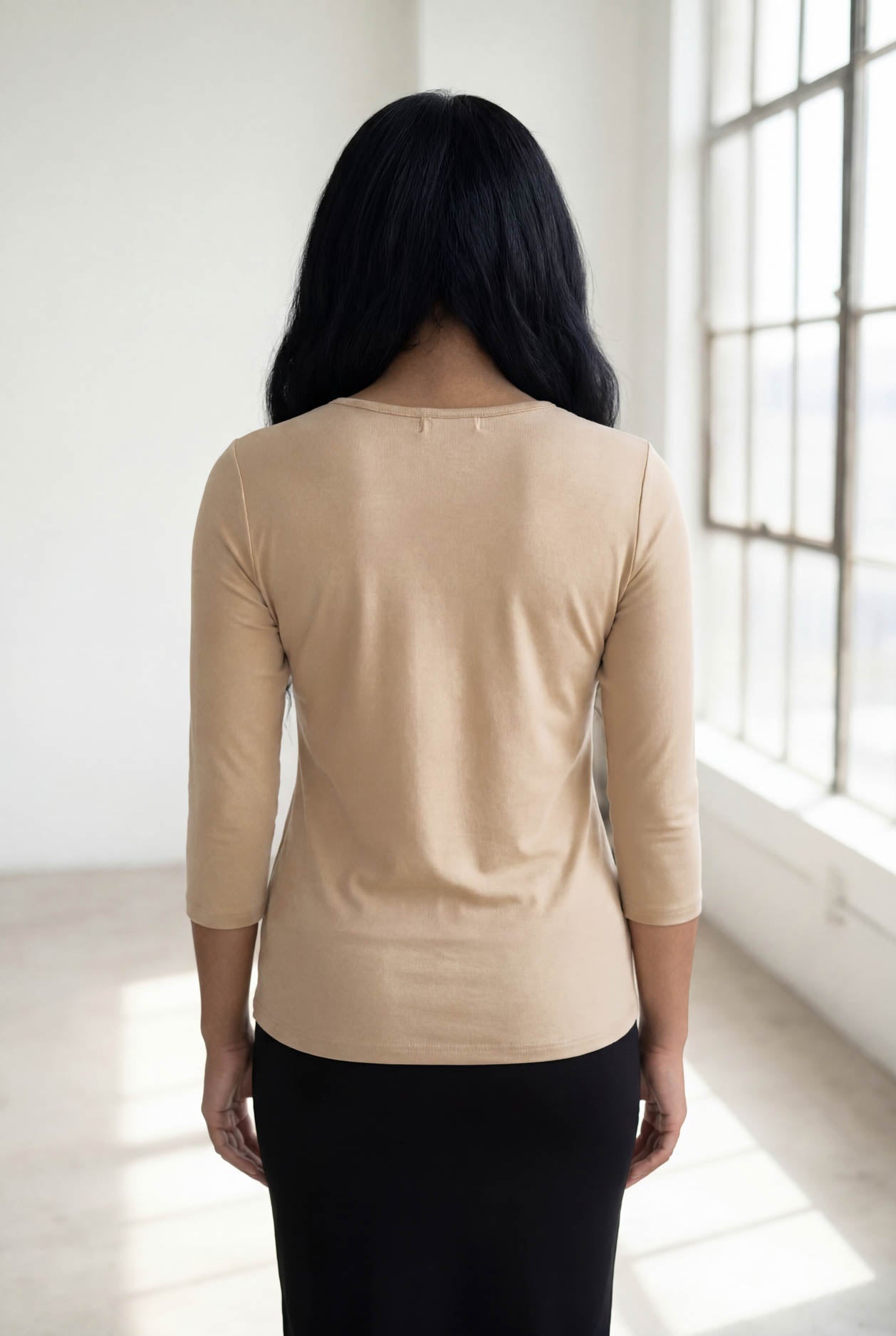 Model wearing Nuggles® 3/4 Essential Tee in Khaki