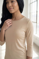Model wearing Nuggles® 3/4 Essential Tee in Khaki