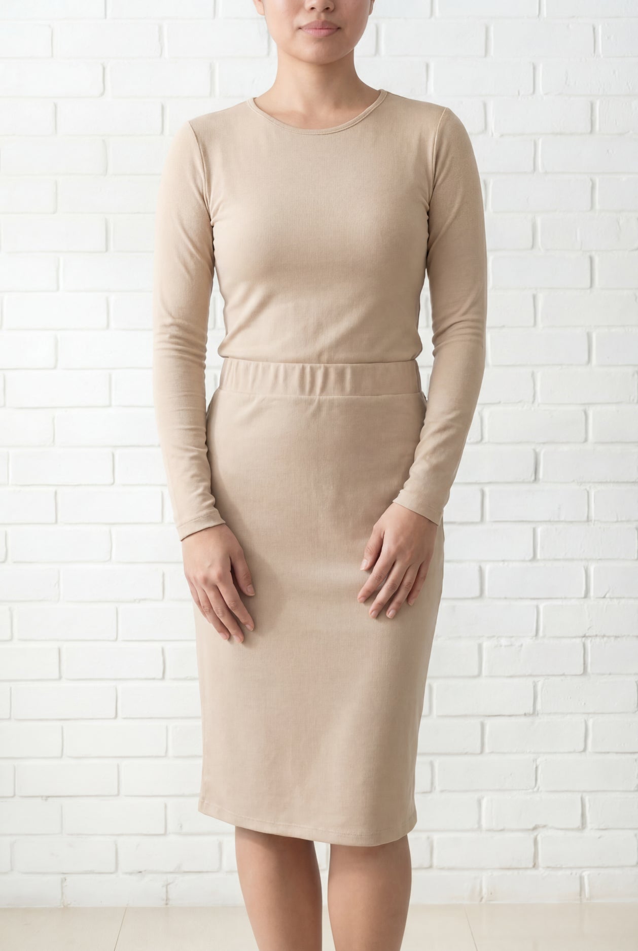 Model wearing Nuggles® 25" Relaxed Midi Skirt in Khaki