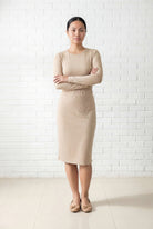 Model wearing Nuggles® 25" Relaxed Midi Skirt in Khaki