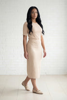 Model wearing Nuggles® 31" Relaxed Midi Skirt in Khaki