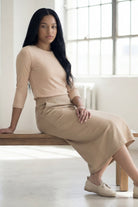 Model wearing Nuggles® 31" Pocket Classic Skirt in Khaki