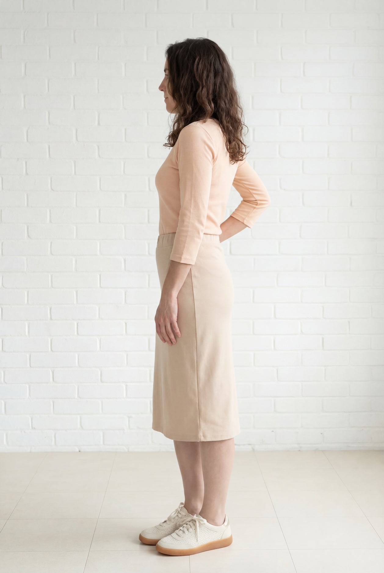 Model wearing Nuggles® 27" Relaxed Midi Skirt in Khaki