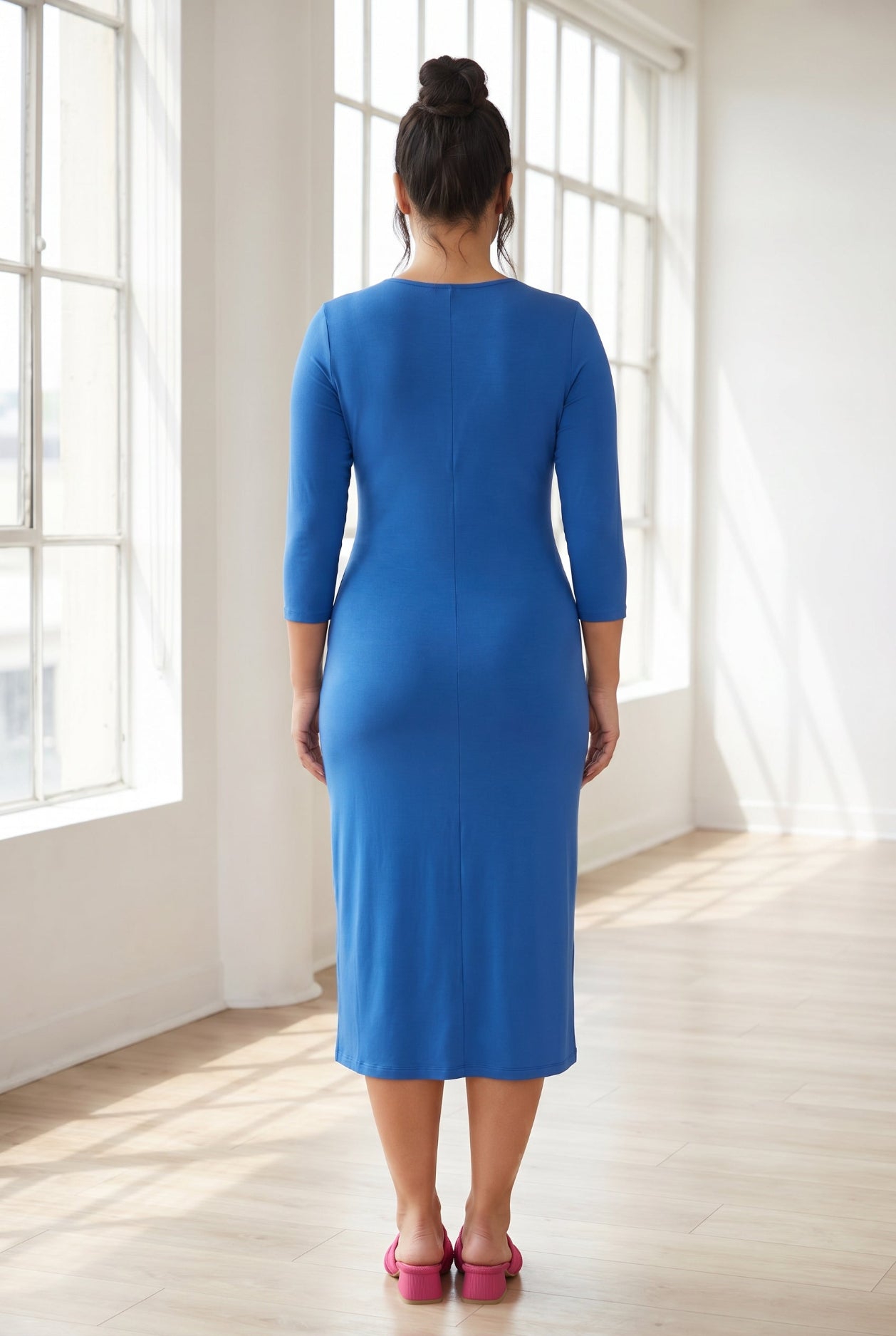 Model wearing Nuggles® Midi Layering Dress in Lapiz Blue