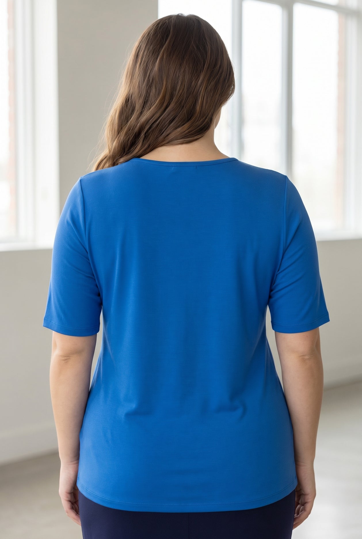 Model wearing the Nuggles® Essential Half Sleeve Tee in Lapiz Blue