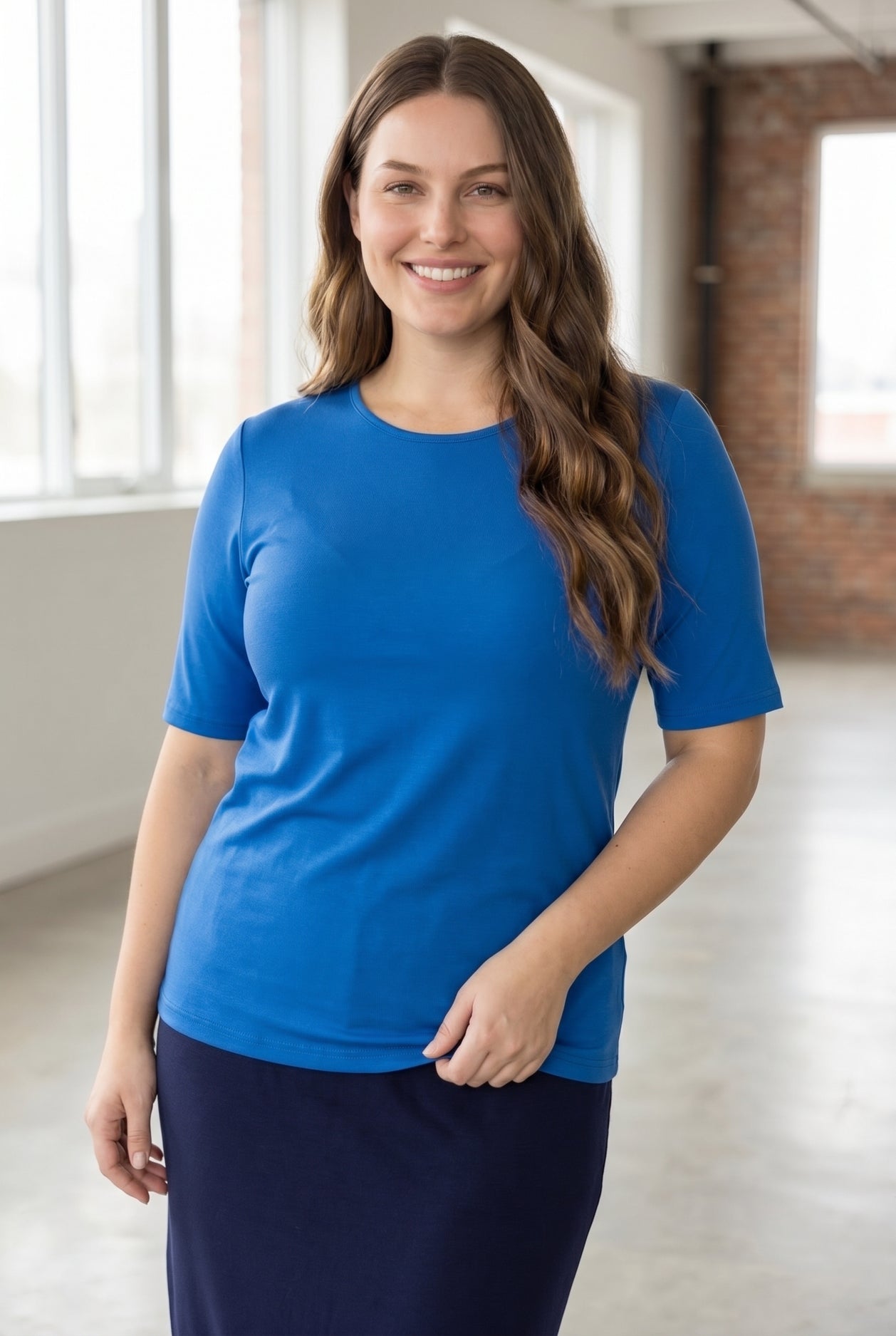 Model wearing the Nuggles® Essential Half Sleeve Tee in Lapiz Blue