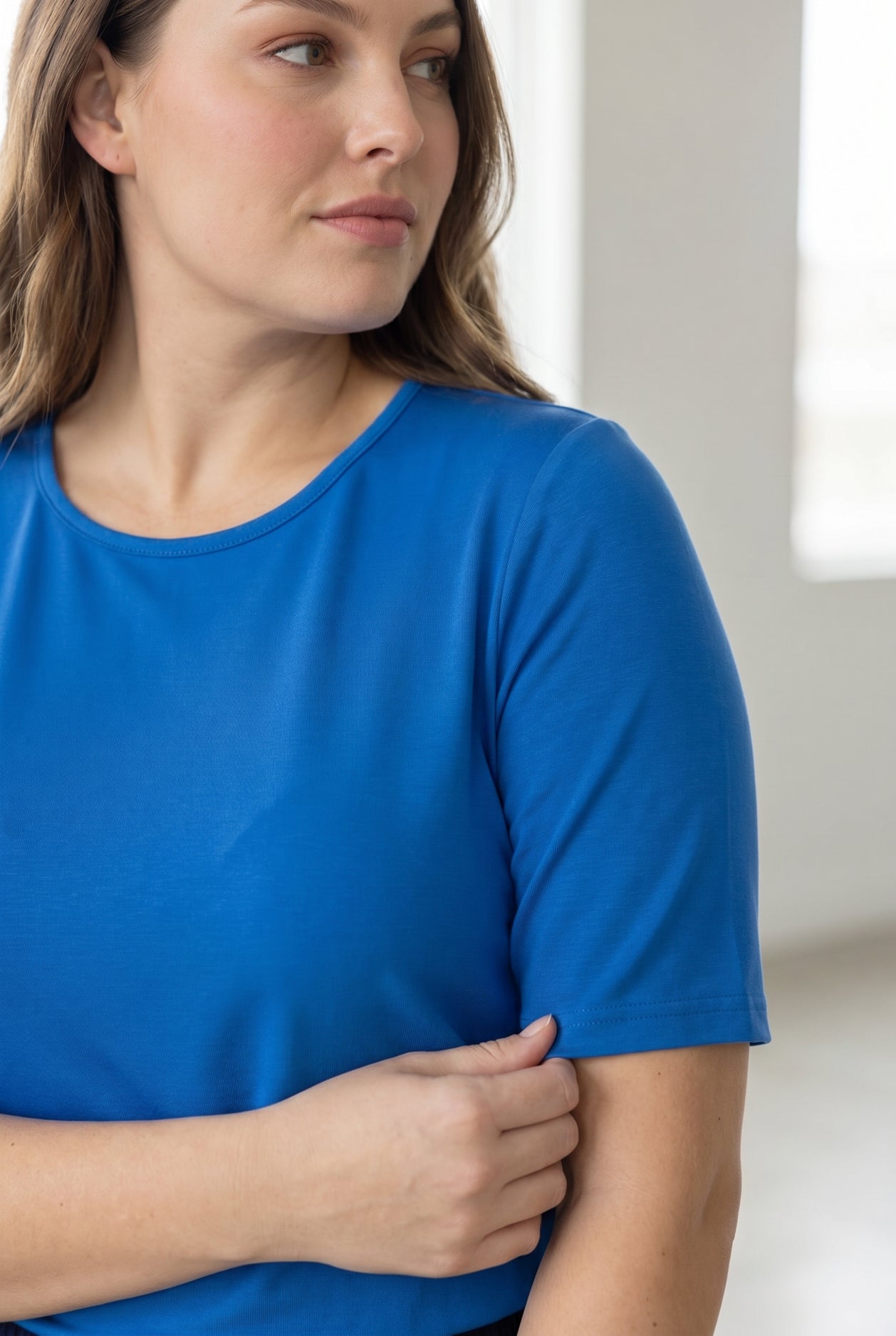 Model wearing the Nuggles® Essential Half Sleeve Tee in Lapiz Blue
