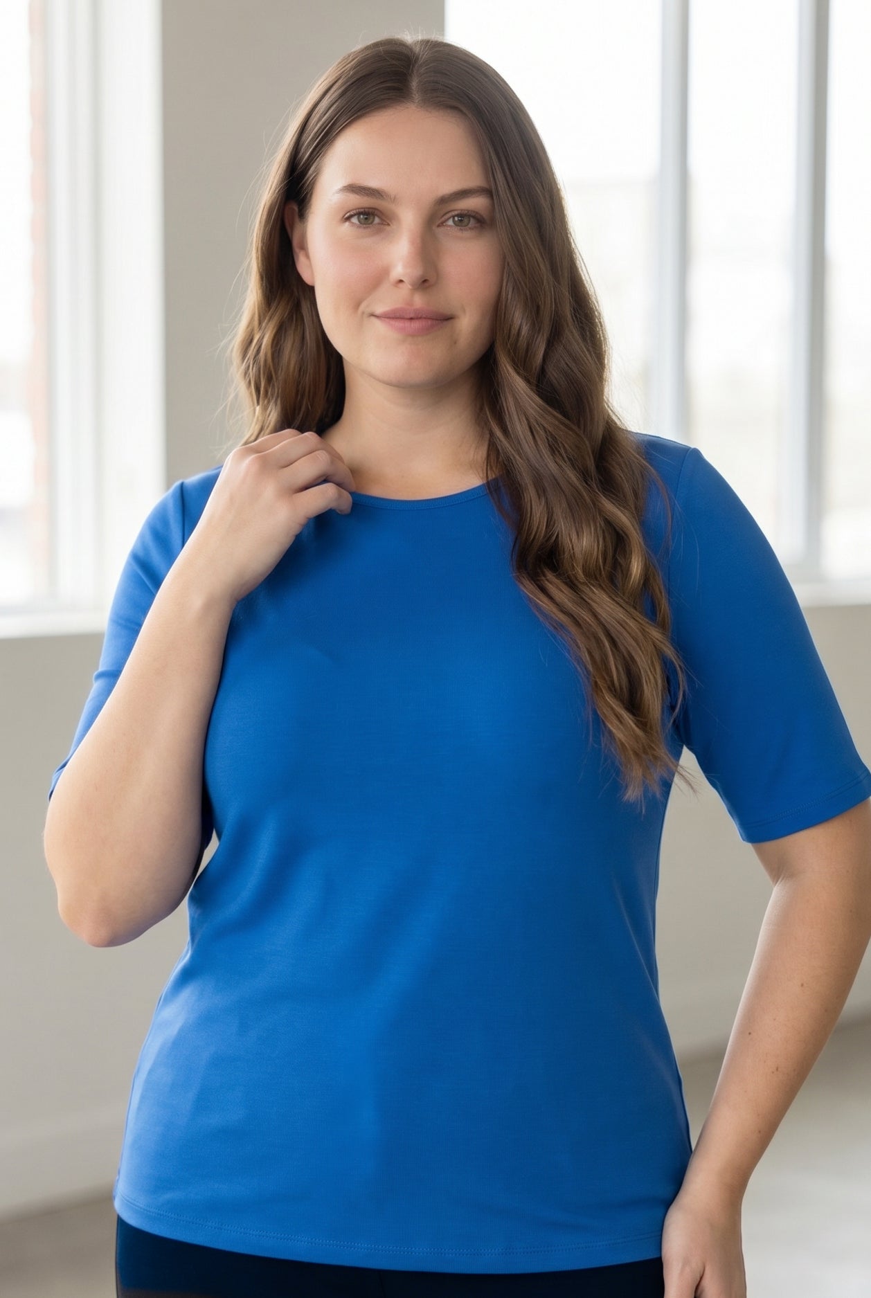 Model wearing the Nuggles® Essential Half Sleeve Tee in Lapiz Blue