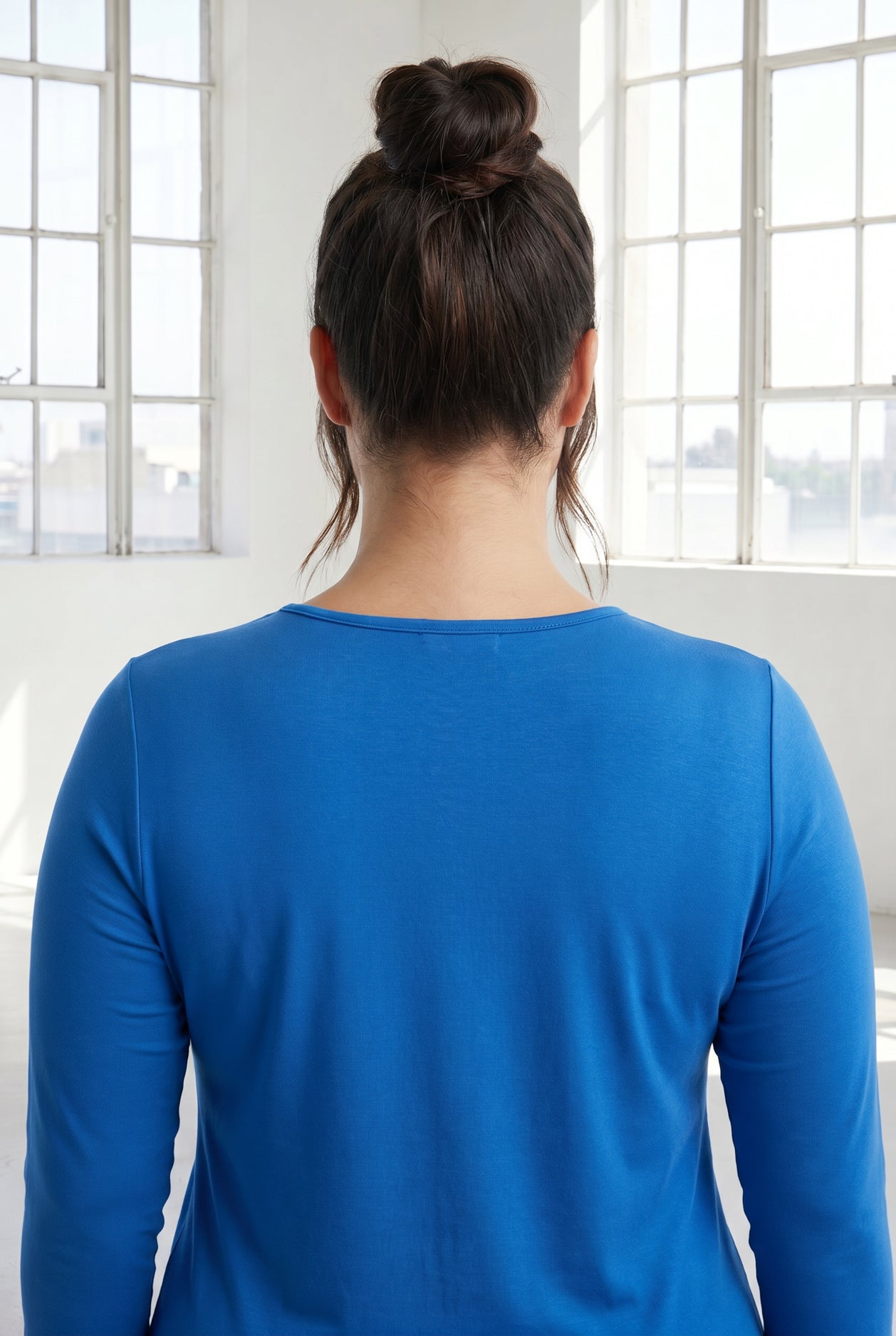 Model wearing Nuggles® 3/4 Essential Tee in Lapiz Blue