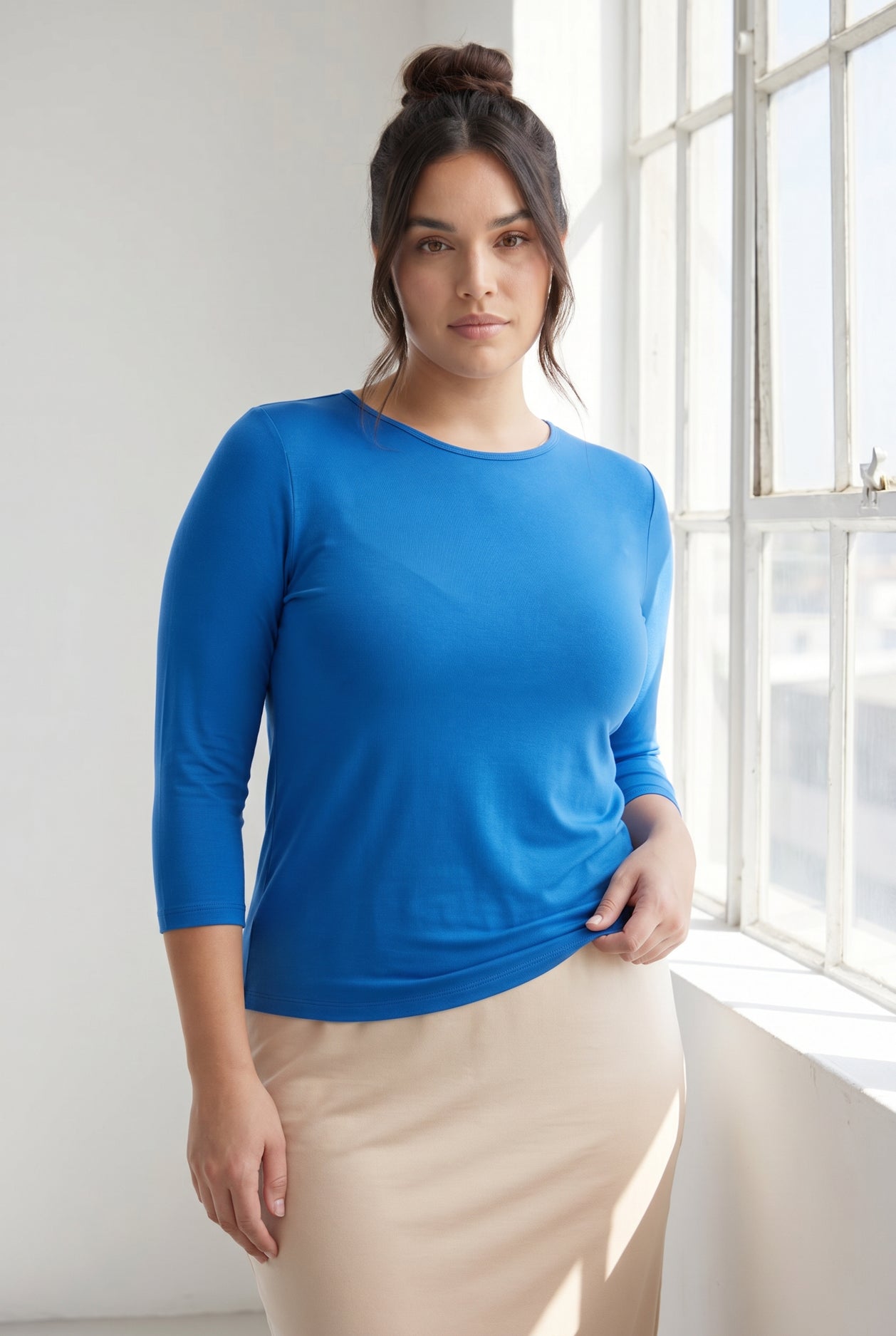 Model wearing Nuggles® 3/4 Essential Tee in Lapiz Blue