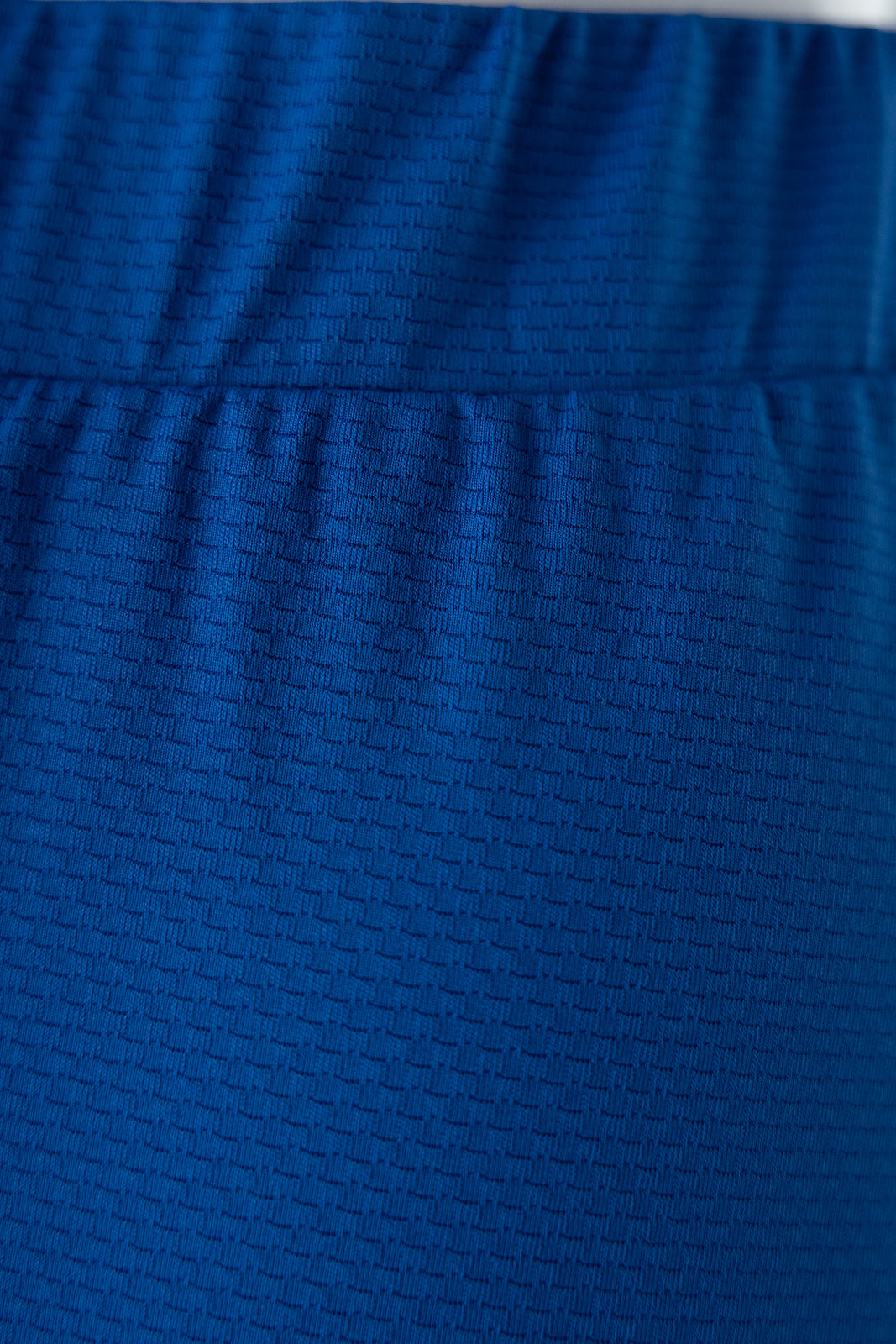 Model wearing Nuggles® 27" All-Sport Skirt in Lapiz Blue