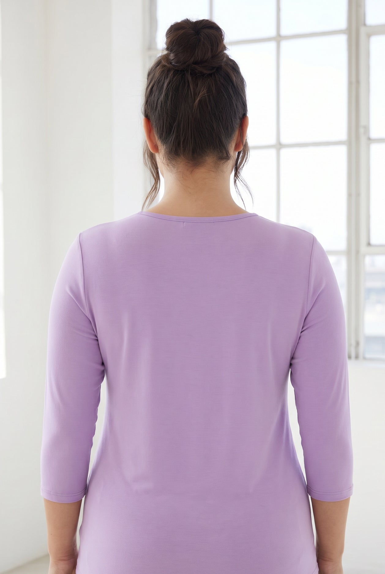 Model wearing Nuggles® 3/4 Essential Tee in Lavender