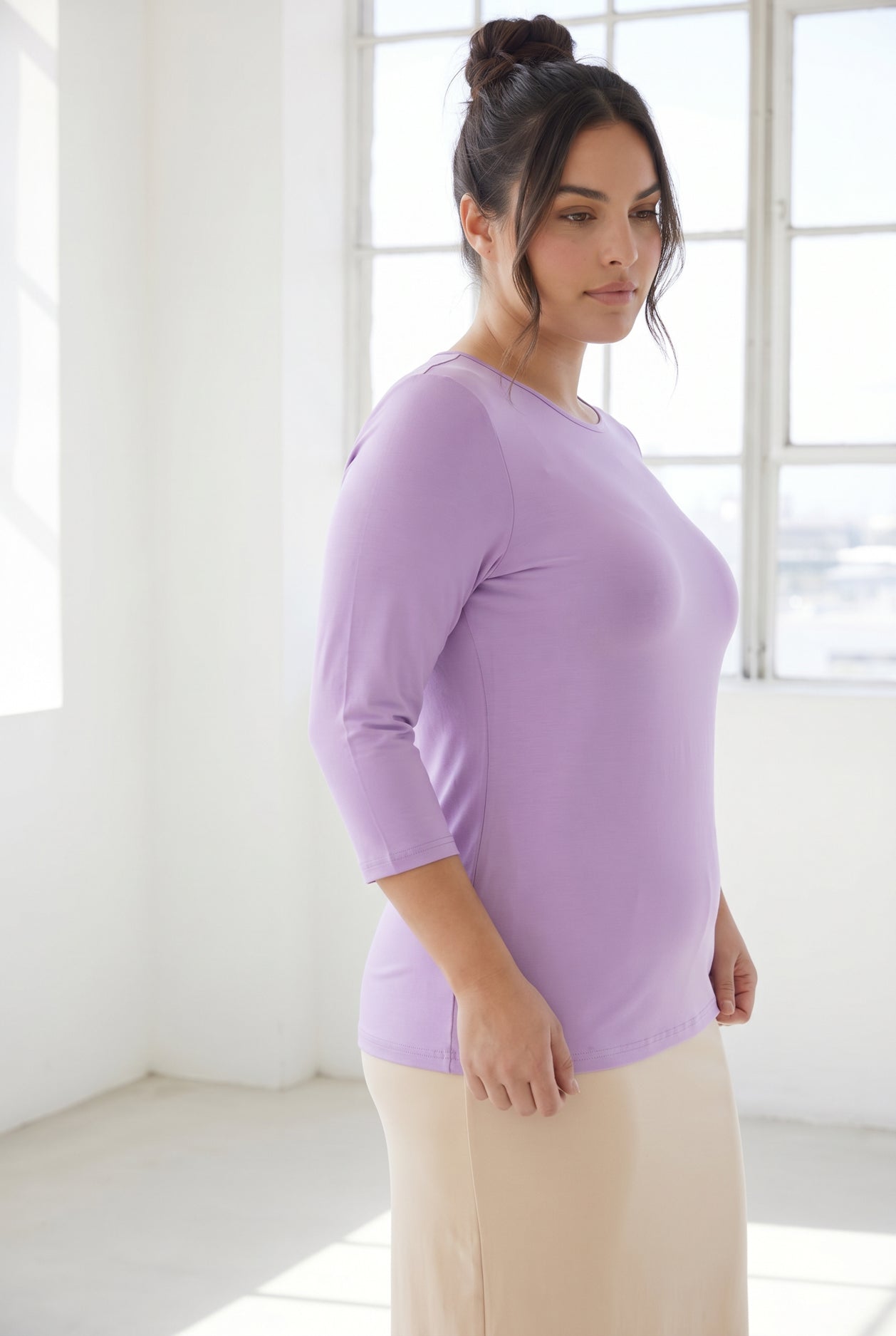 Model wearing Nuggles® 3/4 Essential Tee in Lavender