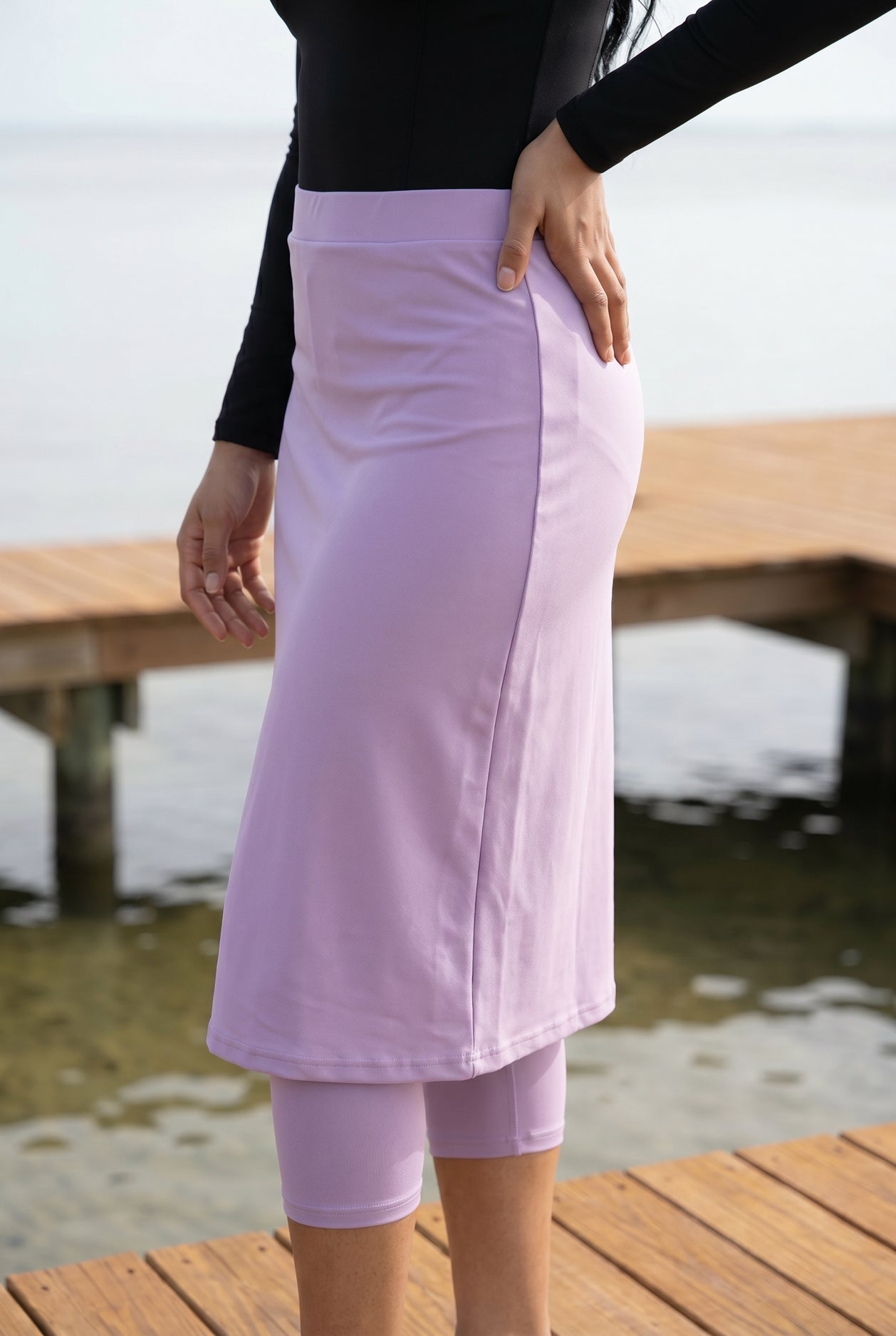 Model wearing Nuggles®  27"All-Sport Skirt  in Lavender