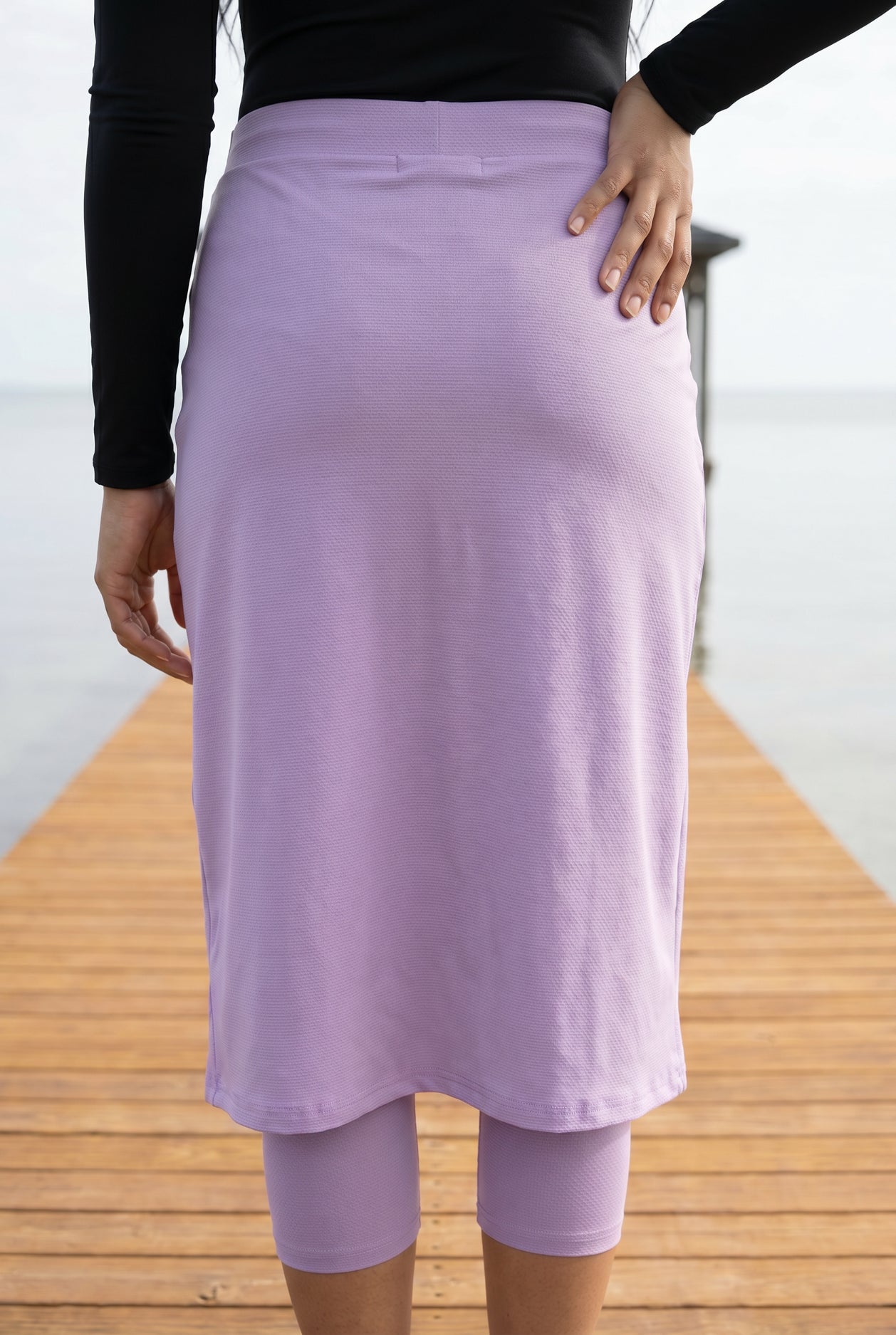 Model wearing Nuggles®  27"All-Sport Skirt  in Lavender