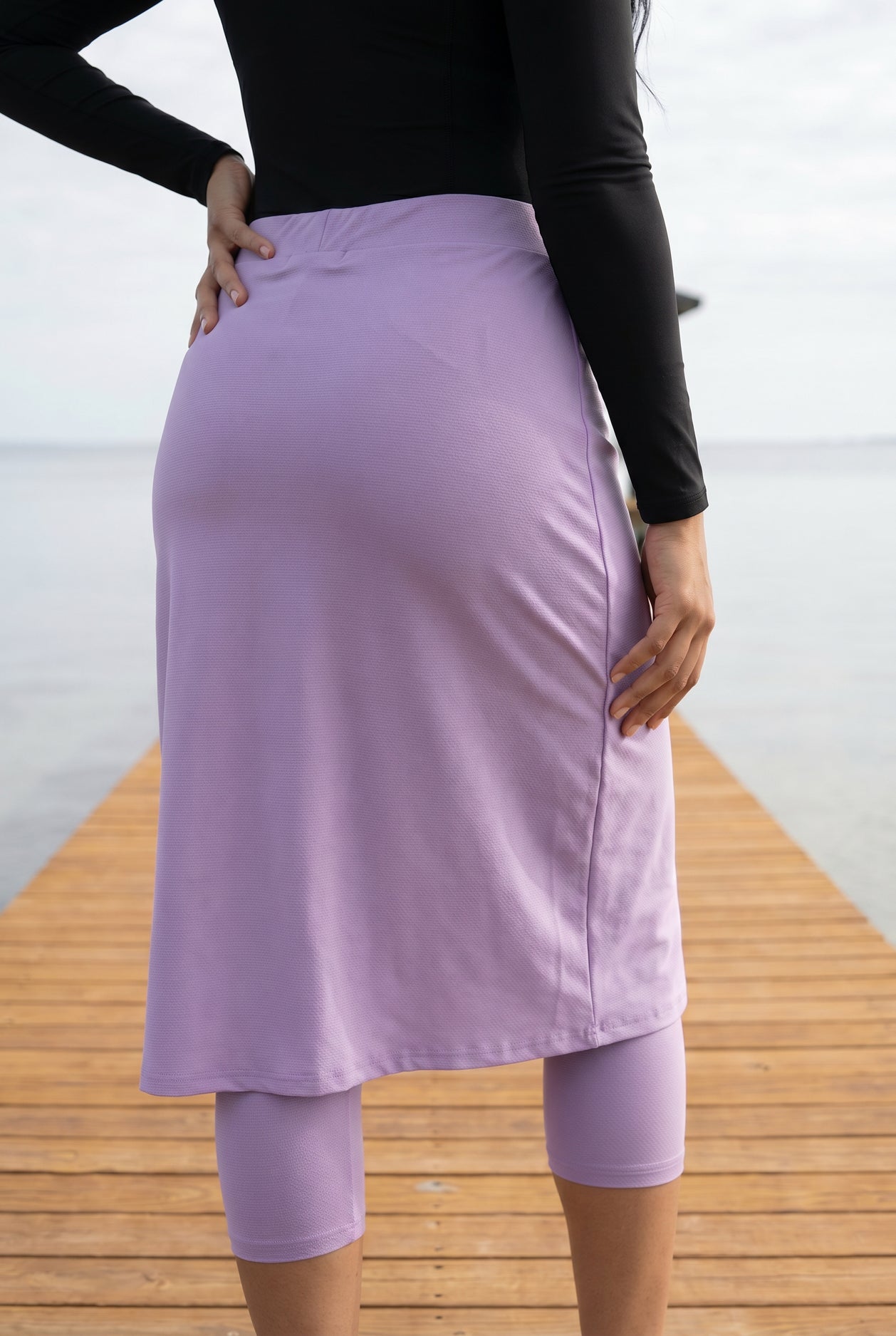 Model wearing Nuggles®  27"All-Sport Skirt  in Lavender