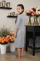 Model wearing Nuggles® Girls Midi Layering Dress in Light Heather 