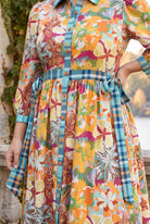 Model wearing Nuggles®  Leila Dress in Marigold