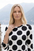Model wearing Nuggles® Gracie Dress in Midnight Dot 