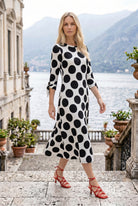 Model wearing Nuggles® Gracie Dress in Midnight Dot 