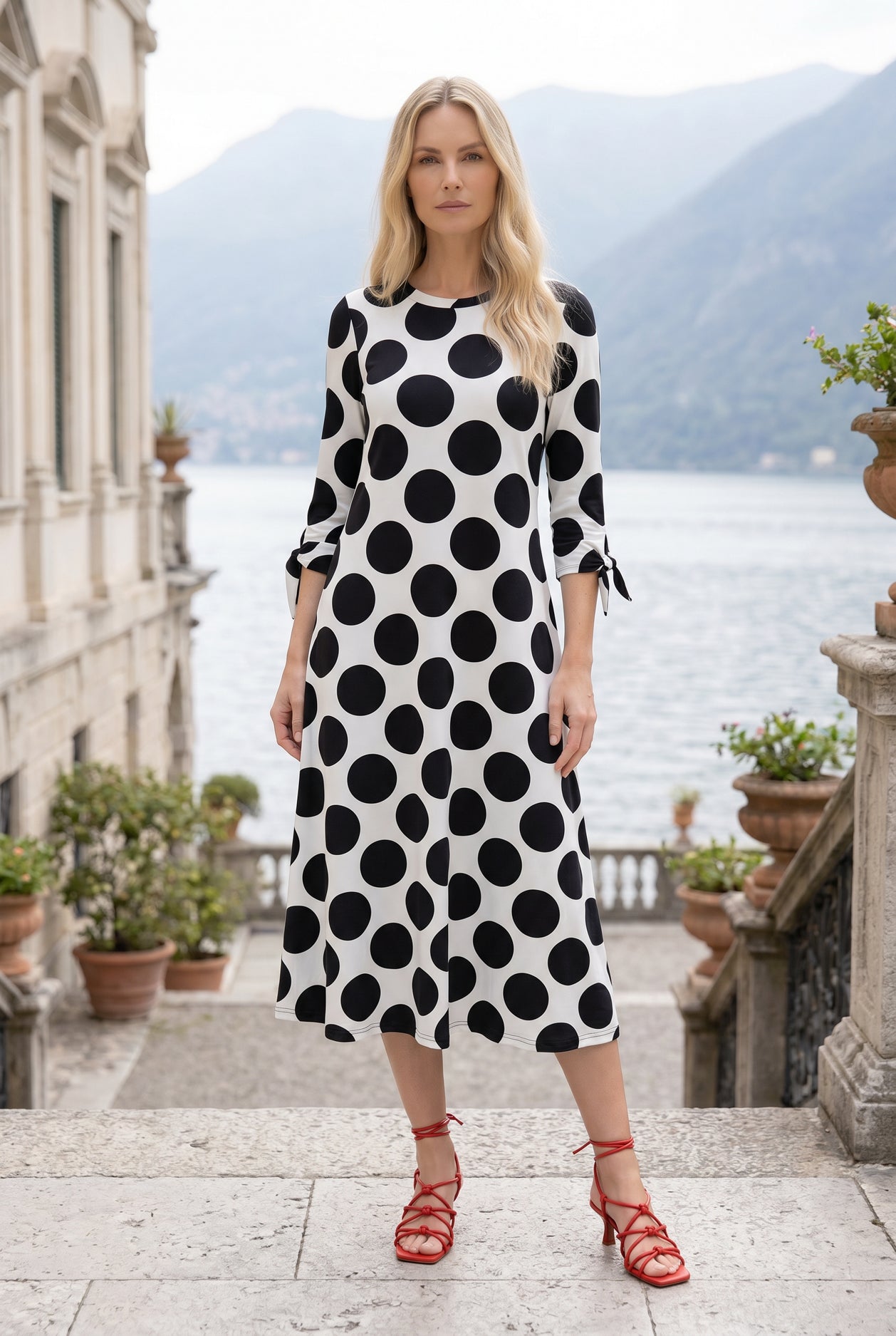 Model wearing Nuggles® Gracie Dress in Midnight Dot 