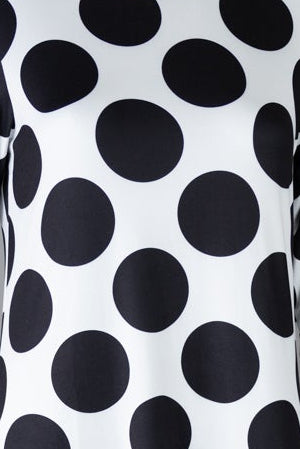 Model wearing Nuggles® Gracie Dress in Midnight Dot 