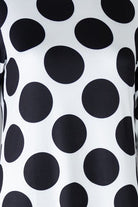 Model wearing Nuggles® Gracie Dress in Midnight Dot 