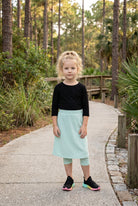 Model wearing Nuggles® Girls All-Sport Skirt in Mint