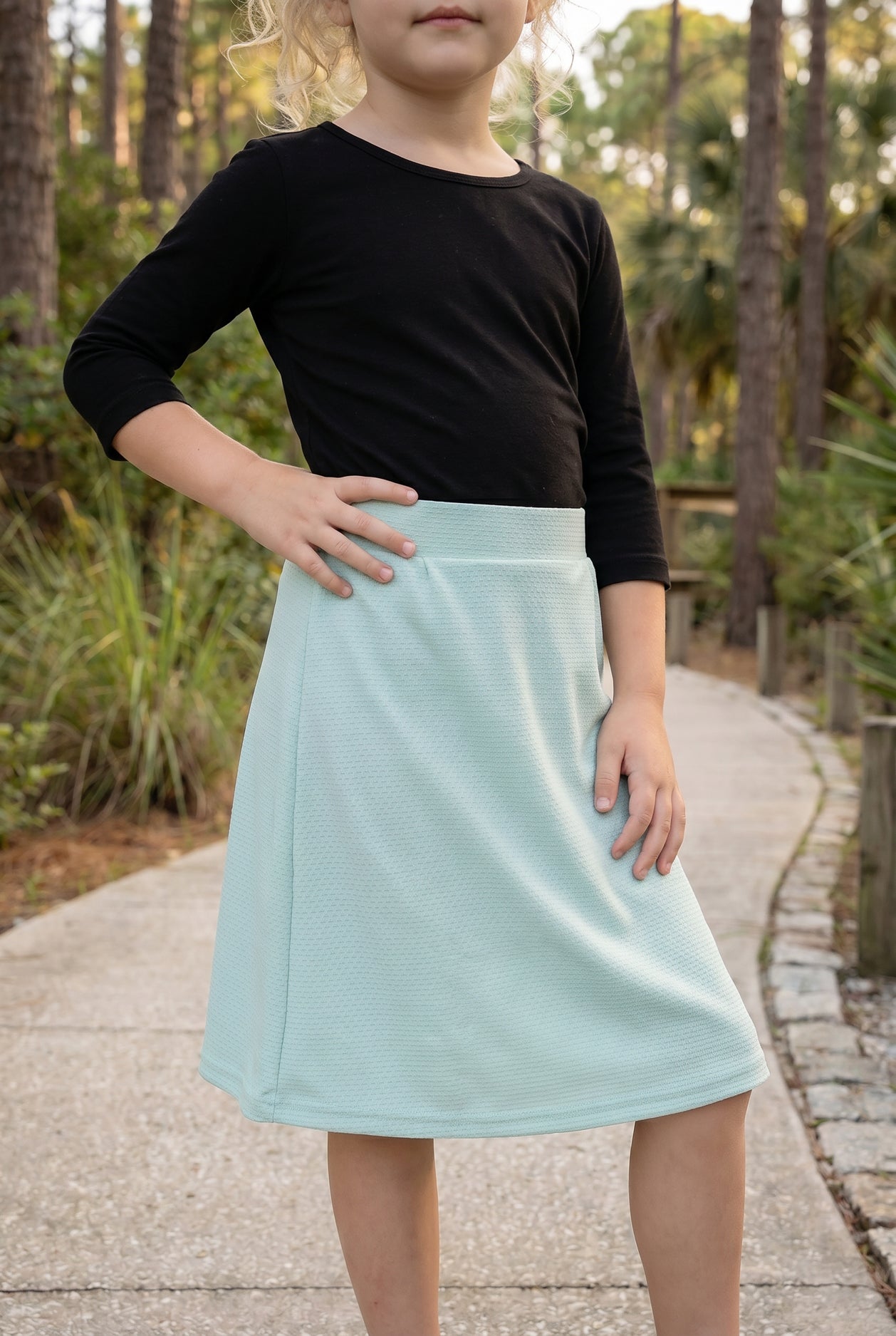 Model wearing Nuggles® Girls All-Sport Skirt in Mint