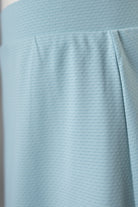 Model wearing Nuggles® Girls All-Sport Skirt in Mint