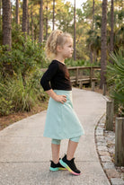 Model wearing Nuggles® Girls All-Sport Skirt in Mint