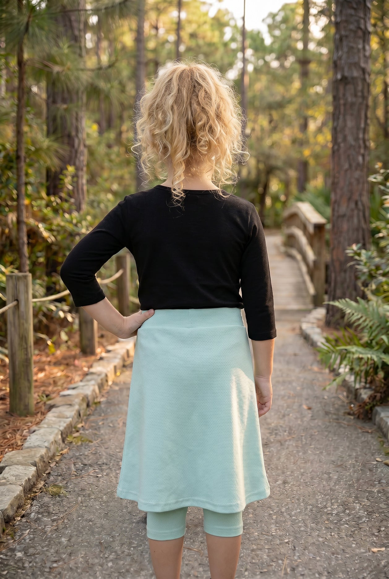 Model wearing Nuggles® Girls All-Sport Skirt in Mint