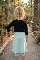 Model wearing Nuggles® Girls All-Sport Skirt in Mint