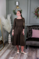 Model wearing Modest Nuggles® Nova Dress in Chocolate Brown