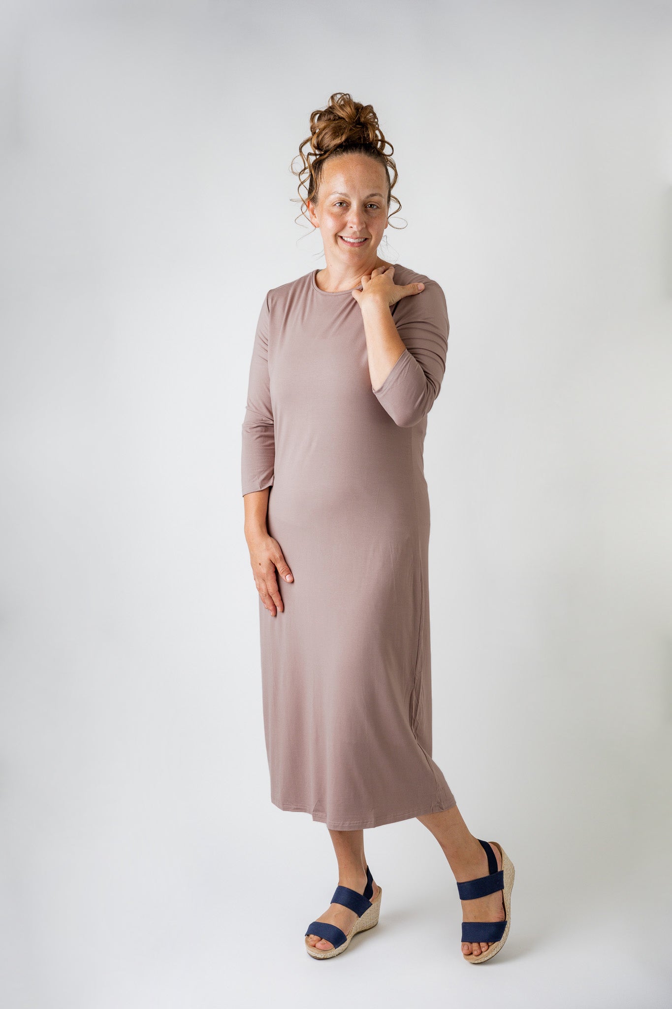 Nuggles® offers a wide variety of Layering Essentials including a layering dresses and essential layering tees. Woman wearing one of our Essential layering dresses in a light color. 