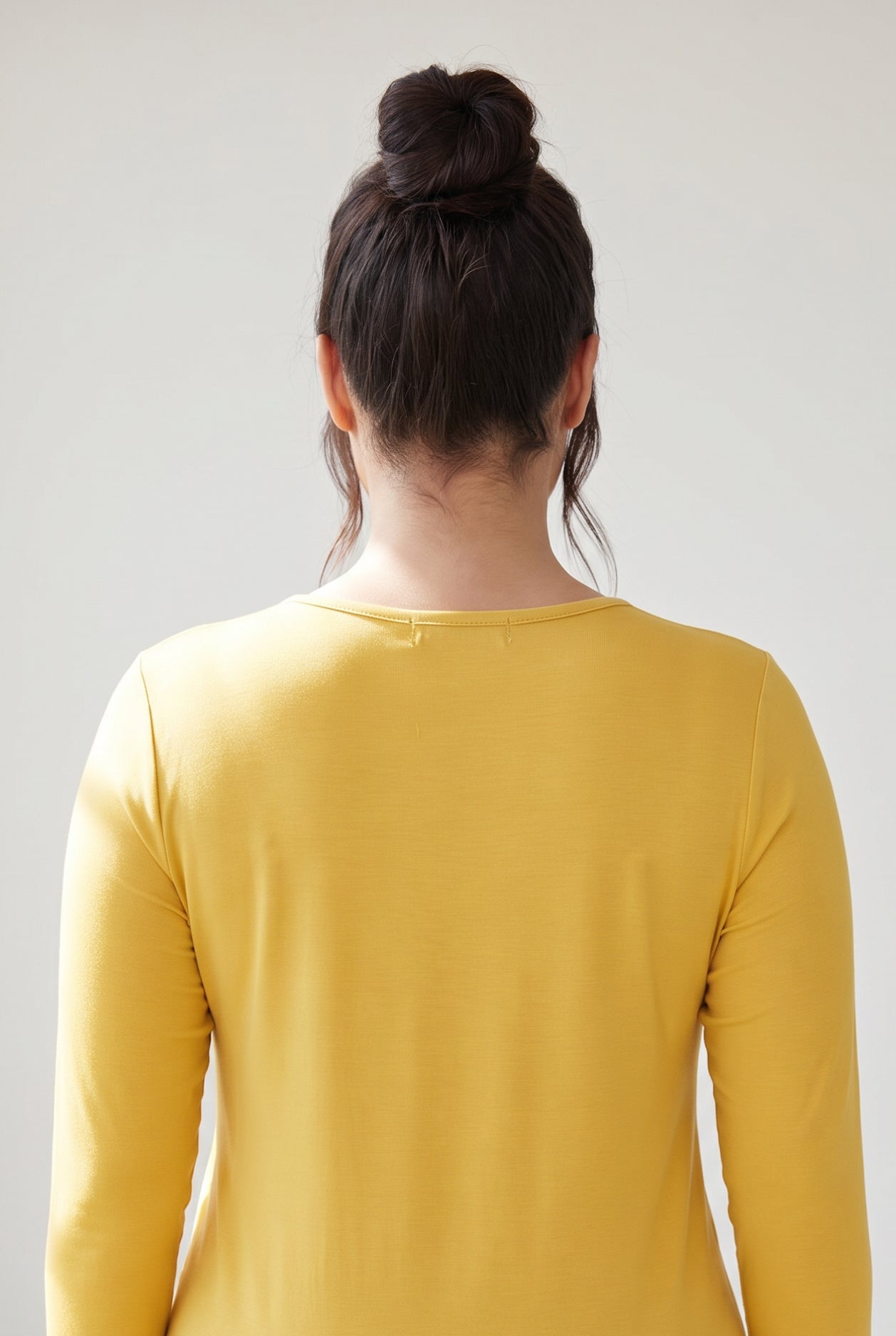 Model wearing Nuggles® 3/4 Essential Tee in Mustard