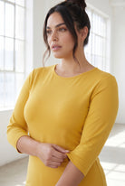 Model wearing Nuggles® 3/4 Essential Tee in Mustard