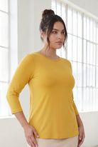 Model wearing Nuggles® 3/4 Essential Tee in Mustard