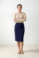 Model wearing Nuggles® 25" Relaxed Midi Skirt in Navy