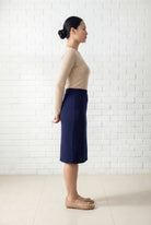 Model wearing Nuggles® 25" Relaxed Midi Skirt in Navy