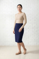 Model wearing Nuggles® 25" Relaxed Midi Skirt in Navy
