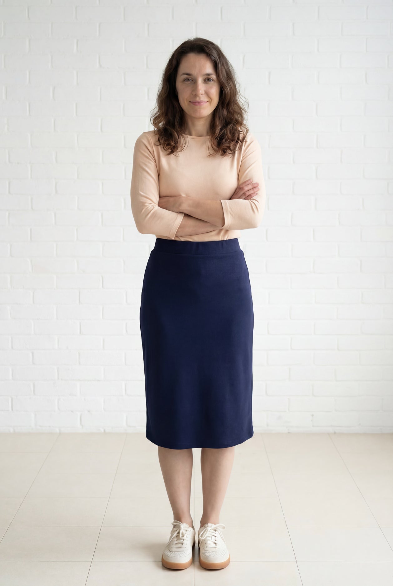 Model wearing Nuggles® 27" Relaxed Midi Skirt in Navy
