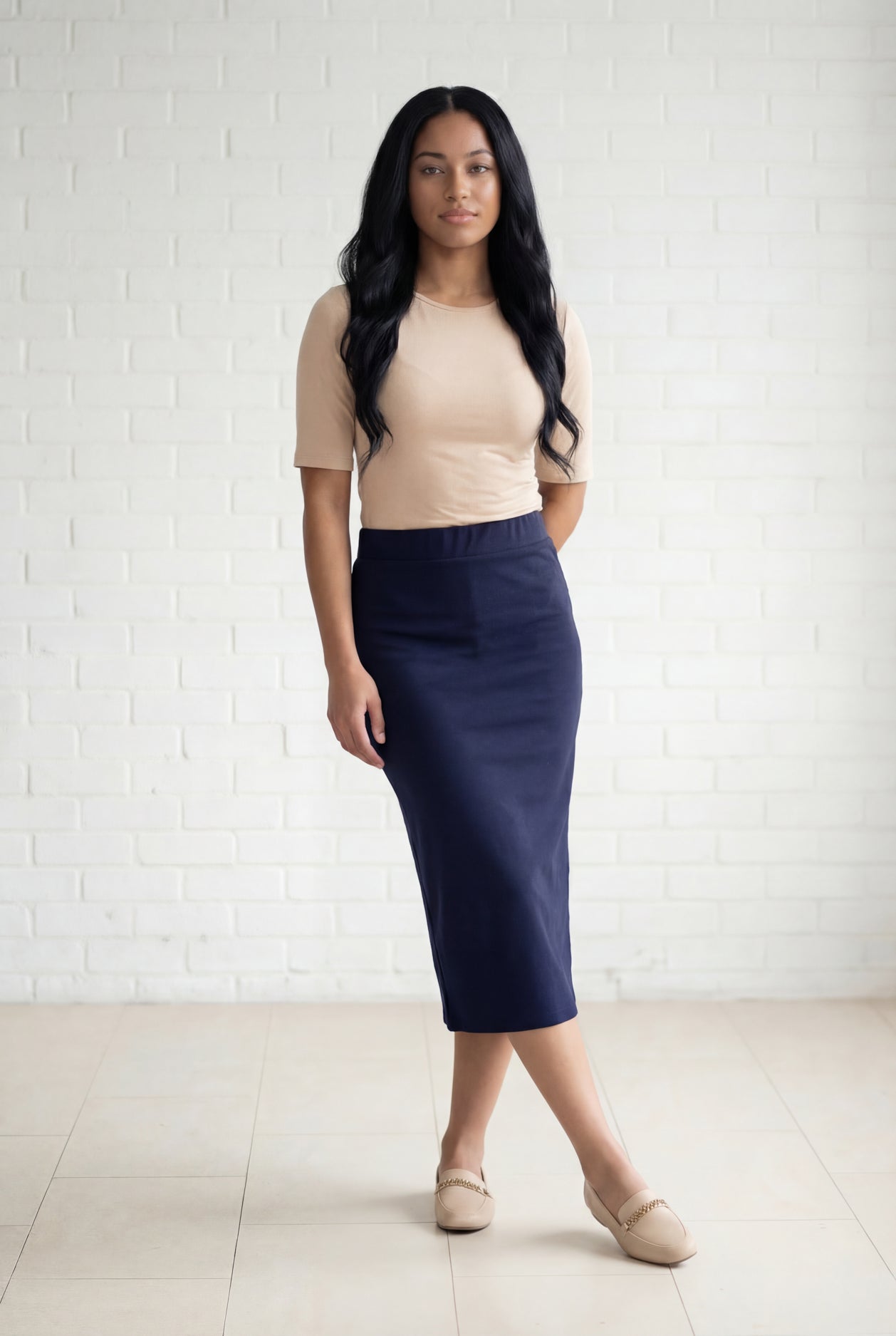 Model wearing Nuggles® 31" Relaxed Midi Skirt in Navy