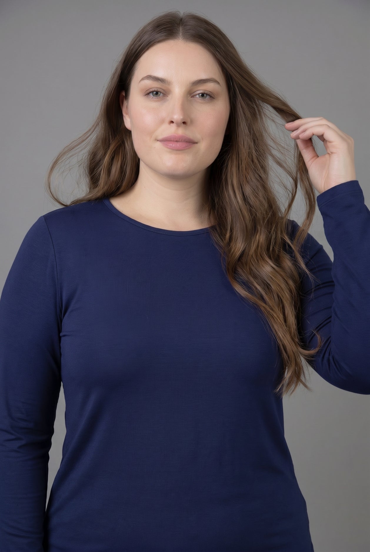Model wearing Nuggles® Long Sleeve Essential Tee in Navy