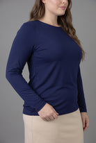 Model wearing Nuggles® Long Sleeve Essential Tee in Navy