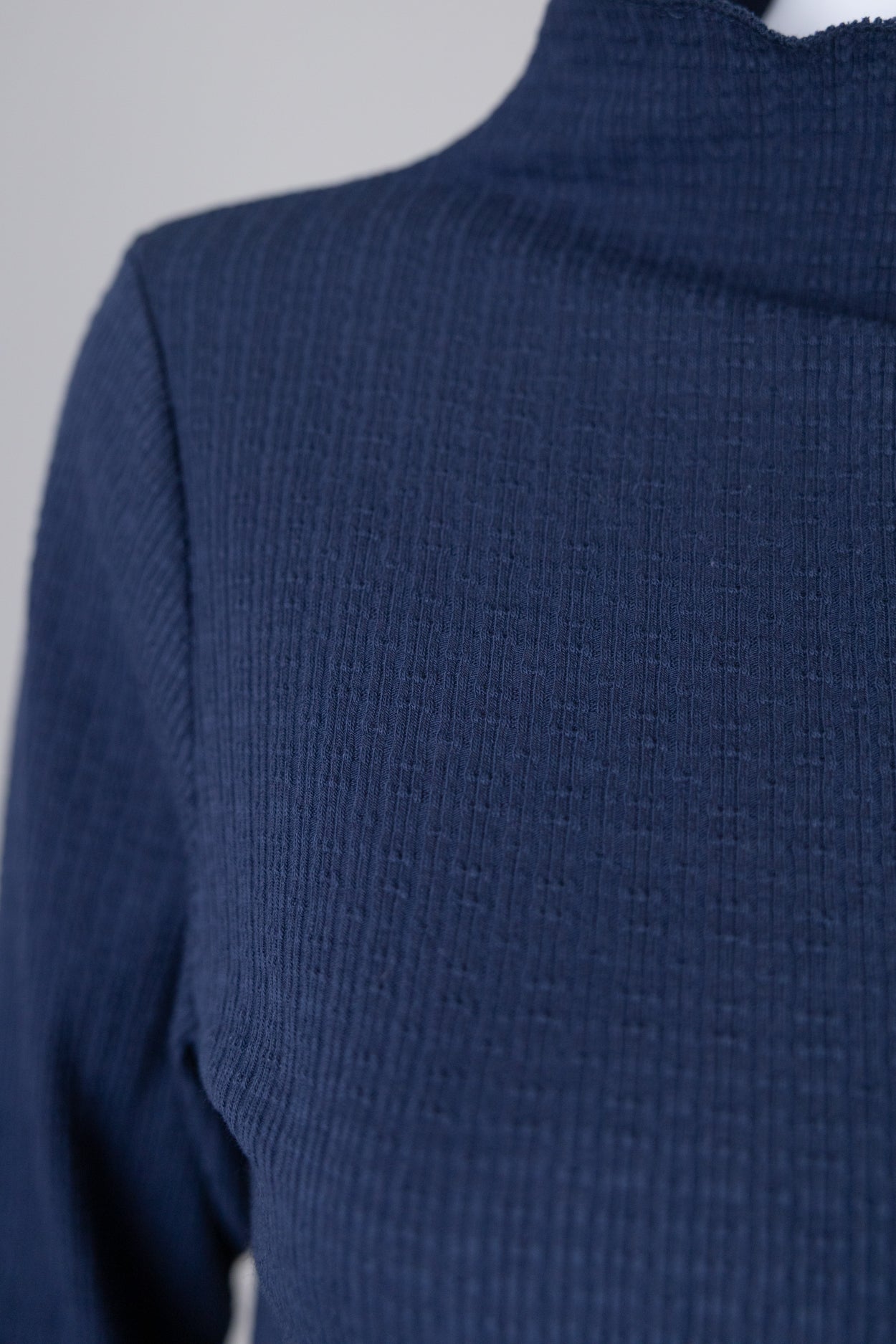 Model wearing Nuggles®  Magnolia Top in Navy
