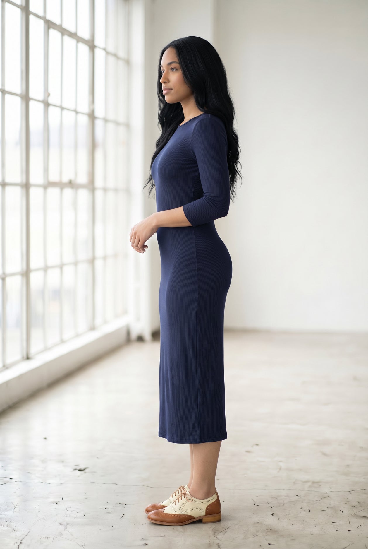 Model wearing Nuggles® Ribbed Midi Layering Dress in Navy