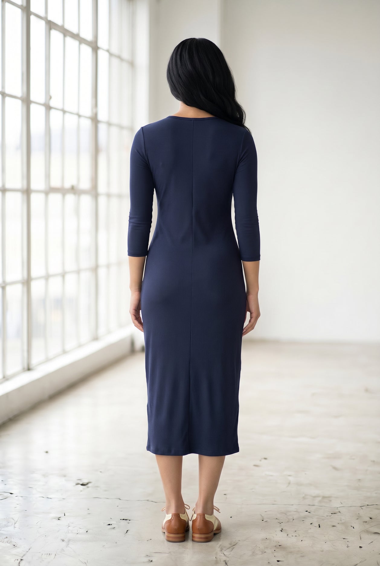 Model wearing Nuggles® Ribbed Midi Layering Dress in Navy